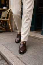 Pemberton Dark Brown Calf Penny Loafer styled - lifestyle primary